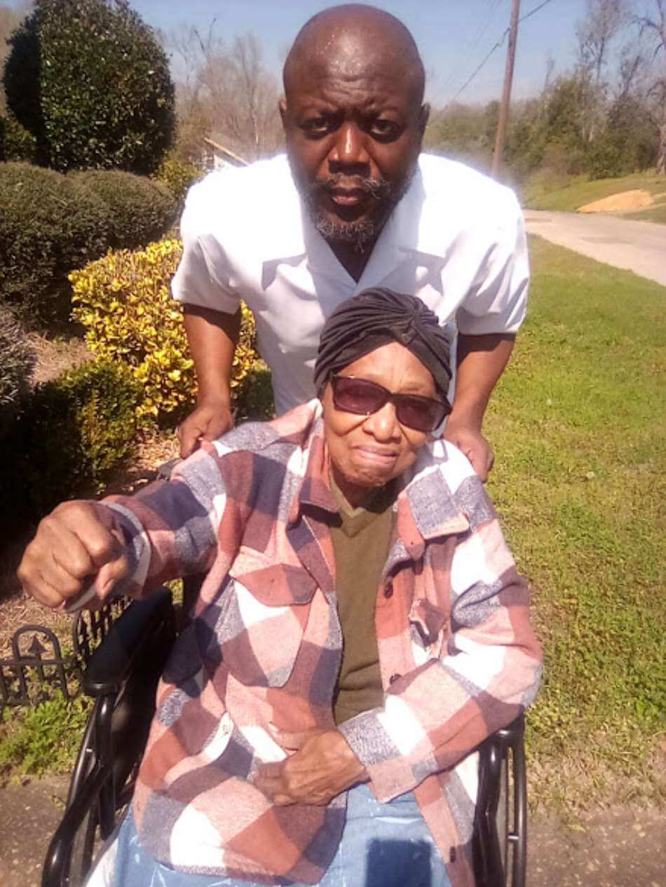 Gilbert Barnes Carter III spends time with Selma Civil Rights Foot Soldier and icon, Ms. Annie Pearl Avery, outside of her home in Selma, Alabama on Wednesday, March 4, 2026.