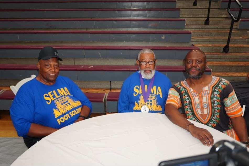 Gilbert Barnes Carter III spends time with Selma Civil Rights Foot Soldiers and icons, Mr. Ronald Peoples, Sr., Esq. and Mr. Roosevelt Goldsby during the 2026 Foot Soldiers Breakfast in Selma, Alabama on Saturday, March 7, 2026.